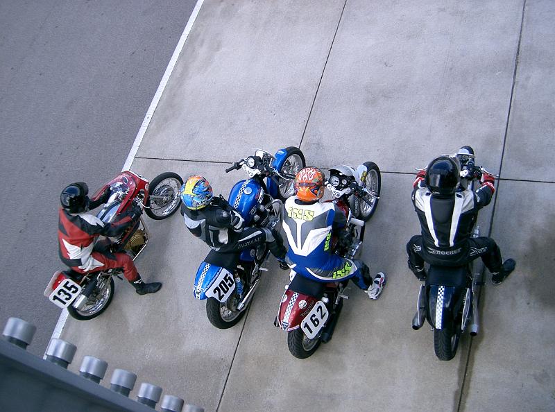 CIMG2506.JPG - 3 modern Thruxtons and a vintage Matchless wating for the race