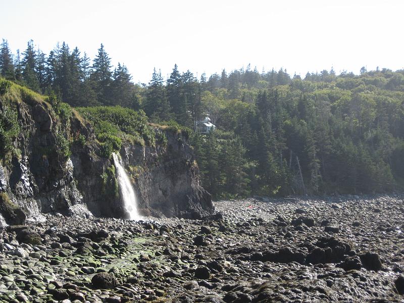148.JPG - Waterfall and the cottage from the beach